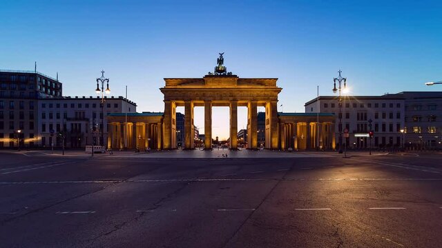 Night to Day Time Lapse of Sunrise behind the Brandenburg Gate , Berlin, Germany