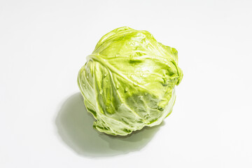 Fresh young cabbage, whole head isolated in white background