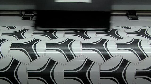 Football Printing Machine, Synthetic Leather Printer in the Production Line of a Soccer Ball Factory. Close Up.