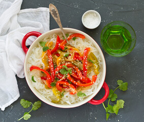 Baked bell peppers with rice noodles in Asian style.