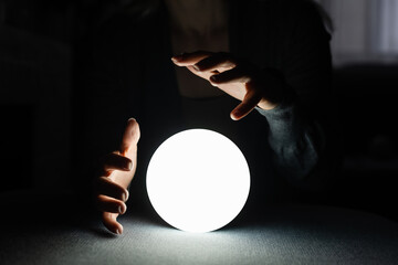 Beautiful woman holding a magical ball