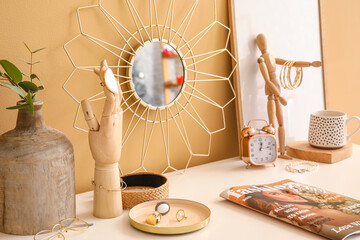 Stylish decor with female jewelry and fashion magazine on dressing table