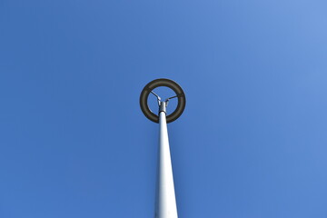 Unusual street lamp against the sky.