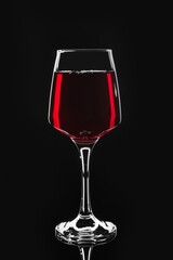 Glass of wine on dark background