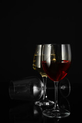 Glasses of wine on dark background