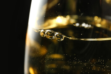 Glass of wine on dark background, closeup
