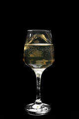 Glass of wine on dark background