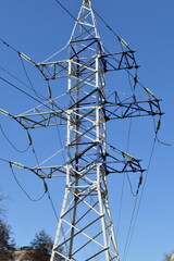 Power pole against the blue sky.