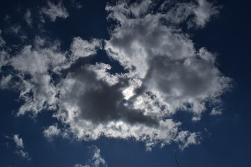 The sun hid behind dark clouds.