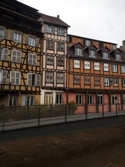 Old traditional architecture half-timbered houses buildings at Petite France Ill Rhine river...