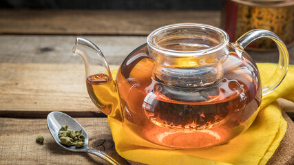 Ginseng tea in a teapot . Ginseng Oolong tea brew in a teaspoon , a teapot and a cup of ginseng...