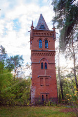 Old high brick water tower in the Gothic style in the estate Natalyevka, Kharkiv region, Ukraine