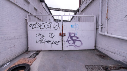 Graffiti about Love on an  Industrial Gate