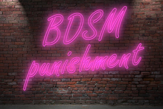 Neon BDSM punishment (bondag, discipline, dominanc, submission) lettering on Brick Wall at night