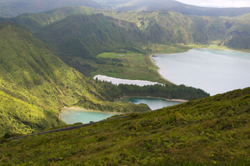Gray rain clouds over hills and lakes in Sao Miguel island. Travel to the Azores.