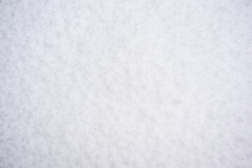 Fresh, wet, heavy snow, pattern and texture in white as a nature background
