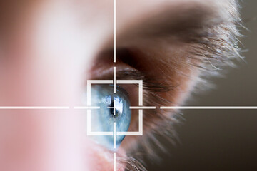 Close up of man eye in process of scanning. Eye monitoring for personality identification.