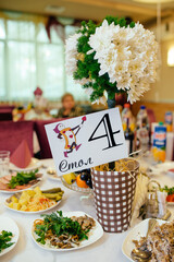 Beautiful table setting for wedding celebration in restaurant. Empty glasses and white napkins are...