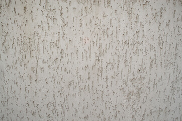 The background of the raised white wall is finished with decorative plaster. Painted flat fade gray background solid wall grain.