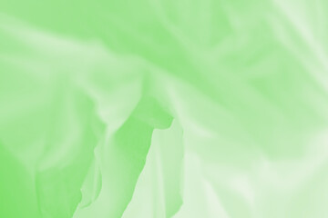 Soft green abstract background, flowing fabric, full frame background