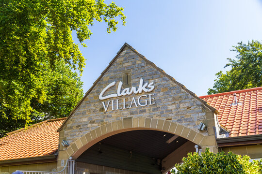 Editorial, Entrance Sign for Clarks Village Outlet Shopping Village