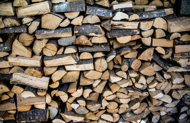 A pile of wood stock logs for fire place