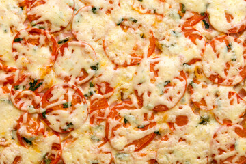 pizza with ham and cheese tomatoes and herbs flat lay seamless background