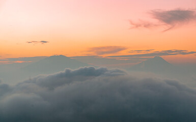 The atmosphere of the sunrise time on Mount Sumbing with clouds