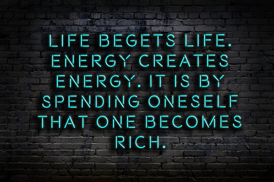 Smart and motivational quotation. Neon sign on brick wall