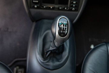 Sports car shifting positions illustrated on the head of stick for 6 speed.