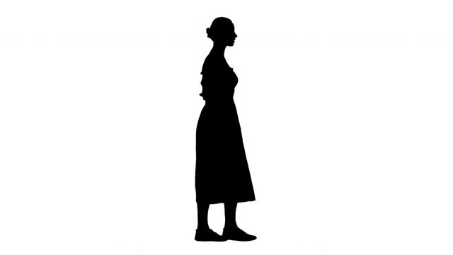 Silhouette Young woman in white dress walking.
