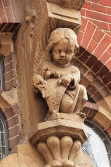 Amsterdam Building Facade Sculpted Detail Representing an Angel Holding Two Keys 