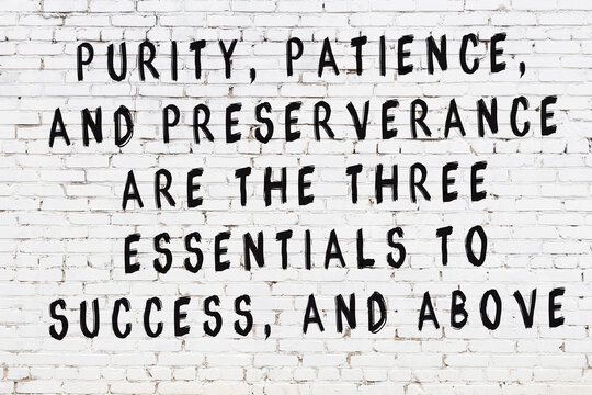 Black painted inscription of smart quote on white brick wall