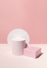 Geometrical shapes like pedestals on the powder pink background. Bright modern stand for products.