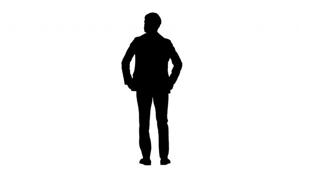 Silhouette Confident businessman standing with hands on hips looking around.