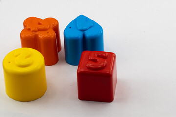 plastic toy blocks with numbers for children, isolated on white