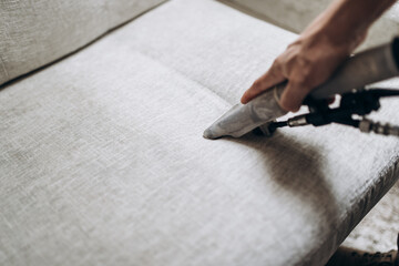 Process of deep furniture cleaning, removing dirt from sofa. Washing concept.