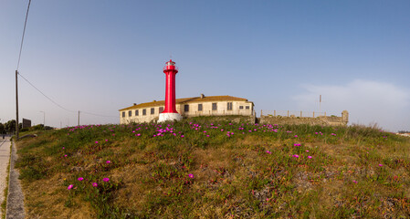 Panoramic shot of the Farol de Esposende (Esposende Lighthouse) set in front of the Fort of Sao Joao Baptista de Esposende is situated at the mouth of Cavado river, north of Portugal.