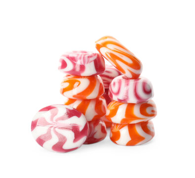 Stacked tasty hard candies on white background