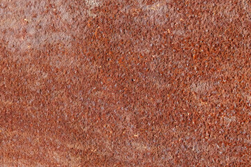 The texture of a metal surface covered with loose orange rust.