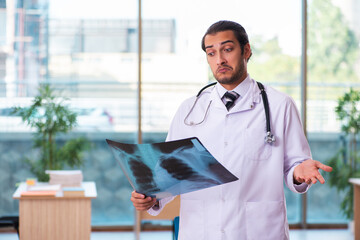 Young male doctor radiologist working in the clinic