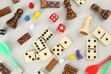Components of board games on grey background, flat lay