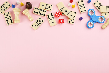 Components of board games on pink background, flat lay. Space for text