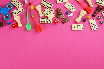 Components of board games on pink background, flat lay. Space for text