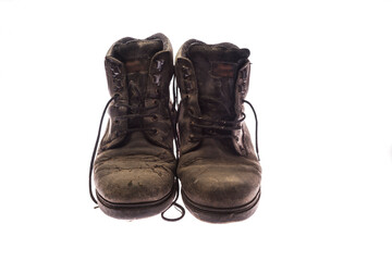 old pair of very worn black shoes
