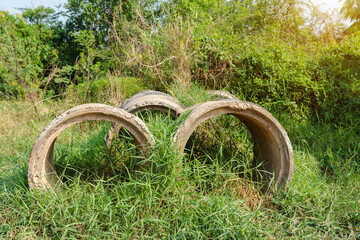 Reinforced concrete pipe for construction,Stacked concrete drainage pipes abstract.