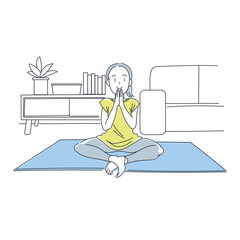 家でヨガをする女性