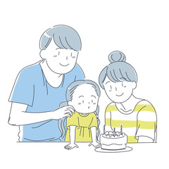 誕生日ケーキの蝋燭を吹き消す女の子と見守る家族