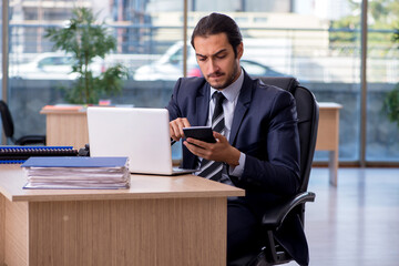 Young businessman employee working in the office