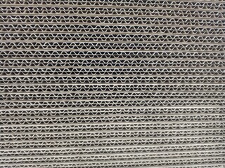 Close-up of cardboard. The texture is cardboard.